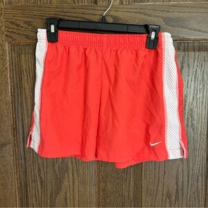 Nike Bright Red Women's Athletic Shorts with White Tag Detail